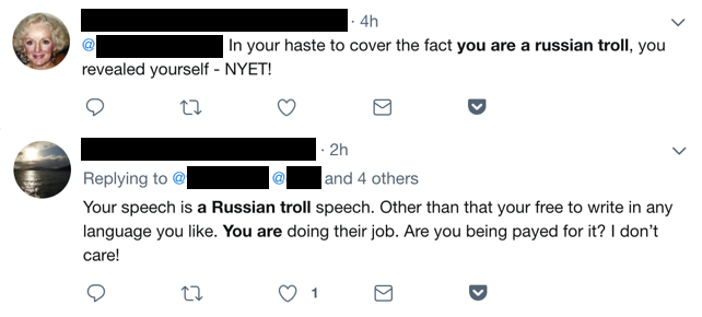 Twitter users accusing one another of being Russian trolls.